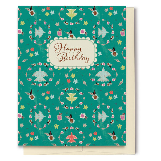 Birds & Floral Wreaths Happy Birthday Card is perfect for that special lady's birthday. Created with a vibrant teal background, this card features a layered look with texture, multi-colored flowers and birds, details reminiscent of Grandma's lace and scripted text which reads, "Happy Birthday." The pattern continues onto the back of the card.