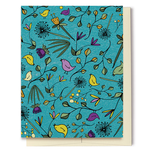 Flowers & Birds Turquoise Blank Card features a hand drawn pattern with birds and flowers in shades of purple, yellow and green on a turquoise background. The pattern extends over the back of the card too. 