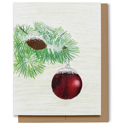Christmas card featuring a red ball ornament hanging from a pine tree branch with a pine cone. Hand drawn using colored pencils.