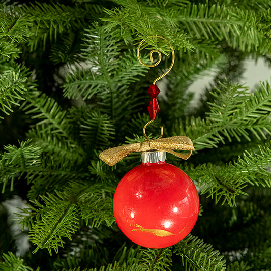 The Carol Hand Painted Glass Ball Ornament is a mix of red and silver shimmer with a hint of metallic gold and a gold shimmer ribbon. Painted using fluid acrylic and acrylic paints. Displayed on a Christmas tree.